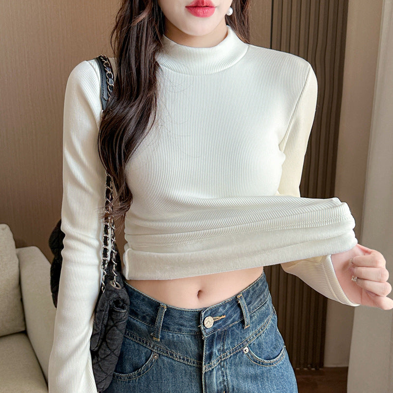 Women's long sleeve shirt with fashionable turtleneck and color-coordinated hem.