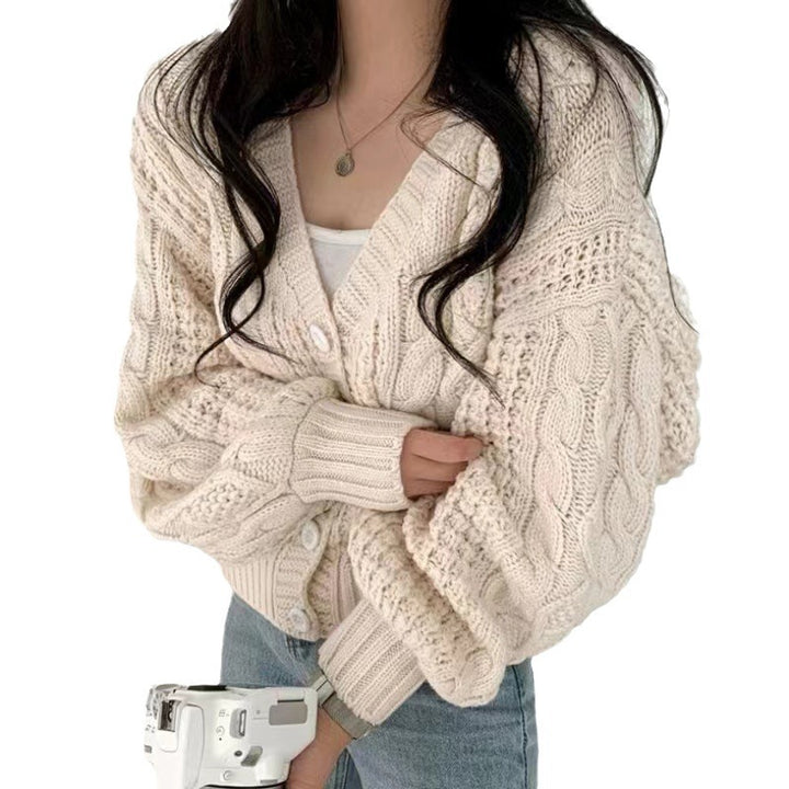 Thick knitted jacket for women with voluminous sleeves and a unique cable pattern Lune London