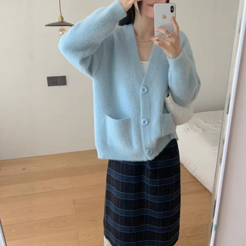 Cardigan pelucheux à boutons pour femmes avec poches élégantes Chic & Stil