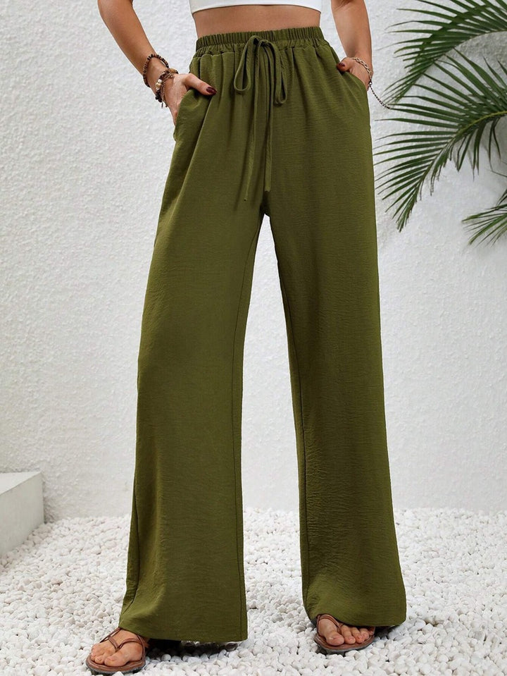 Pantalons larges d'été pour femmes avec taille élastique et poches latérales pratiques Chic & Stil