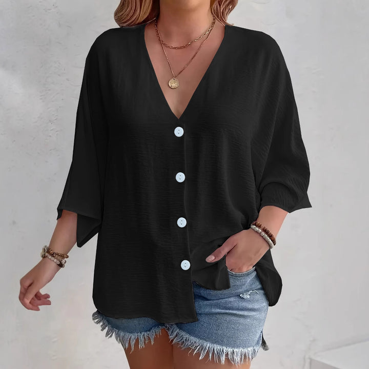 Short-sleeved advantageous blouse for ladies with button placket and V neckline Lune London