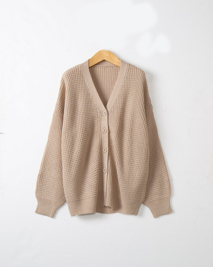 Women's knitted jacket with structured pattern and practical button details Lune London