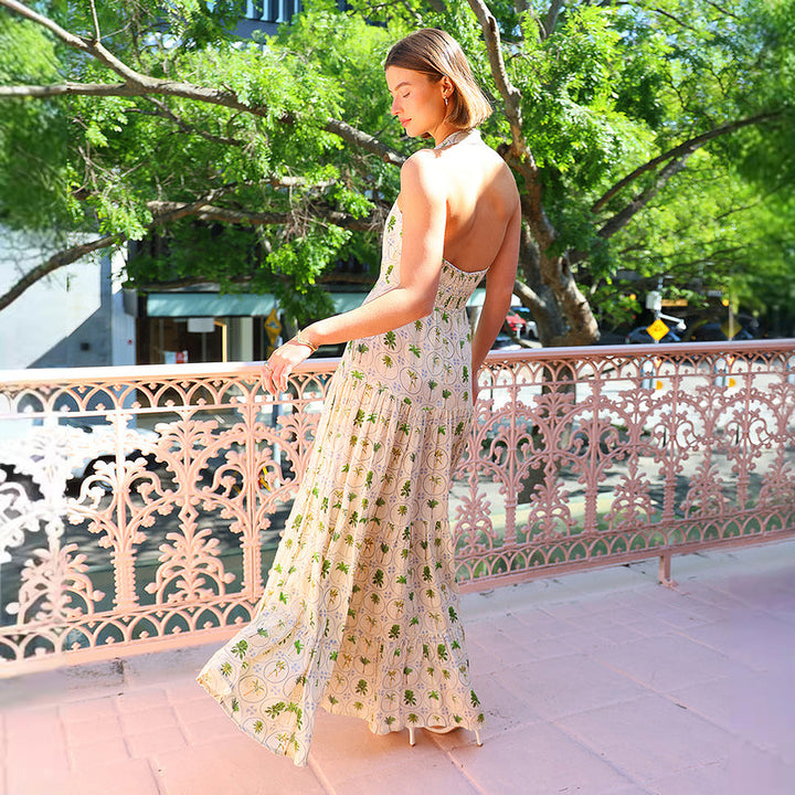 Women’s maxi dress with playful halterneck design and floral pattern mix Lune London
