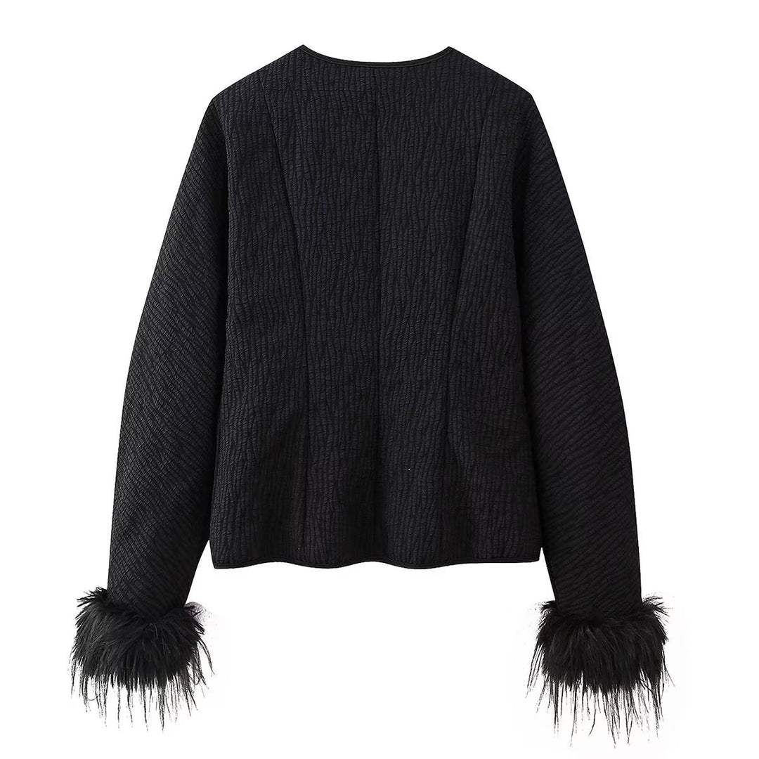 Elegant ladies' down jacket with elaborate ruffle details and high collar Lune London
