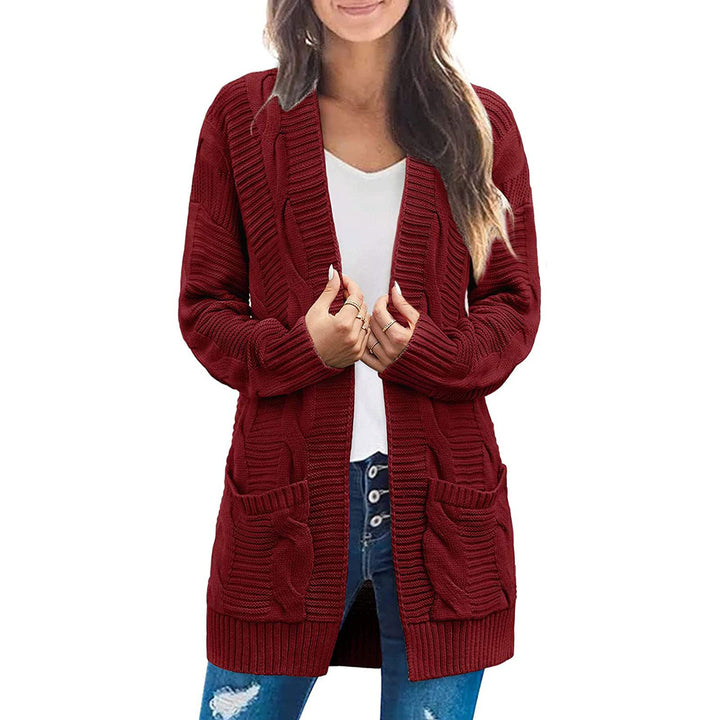 Ladies chunky knit cardigan with elegant cable patterns and practical pockets Lune London