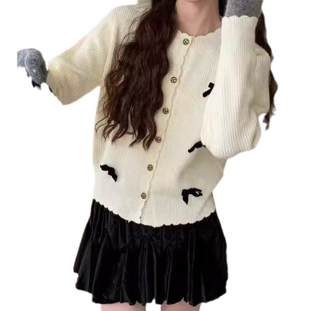 Women's knitted jacket with a playful design and decorative button details Lune London