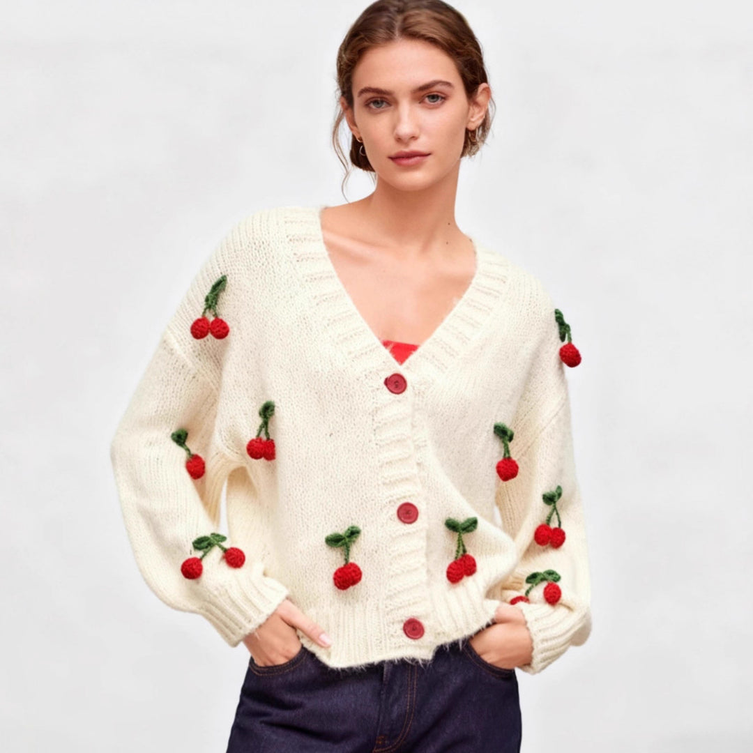 Knitted jacket for women with a cheerful cherry design and practical button details Lune London