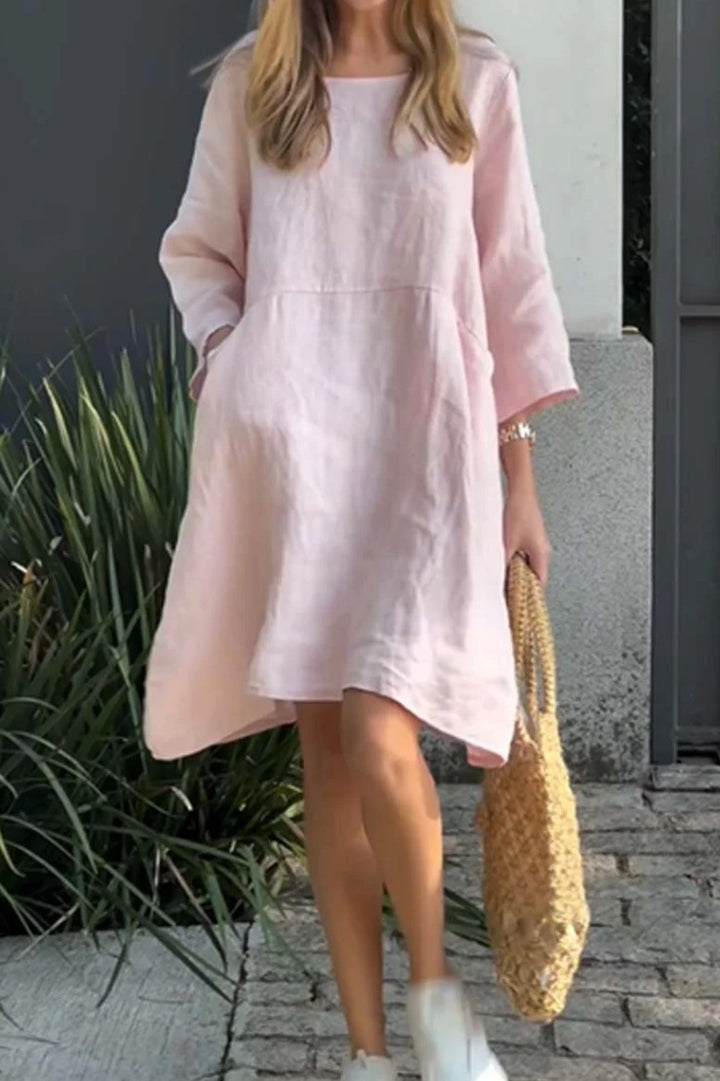 Casual linen dress for women with practical pockets and asymmetrical hem Lune London