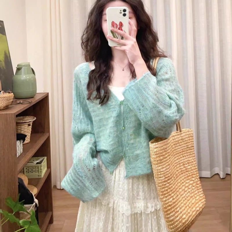 Lightweight knit cardigan for women with a fine openwork knit structure and a loose fit Lune London