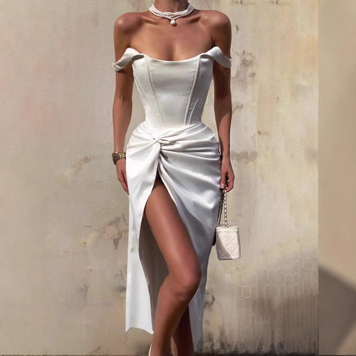 Elegant maxi dress for women with off-shoulder design, side slit, and refined draping Lune London