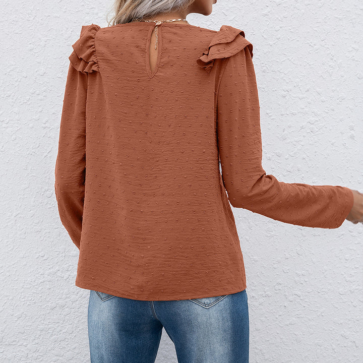 Casual women's top with ruffle details and textured surface Lune London