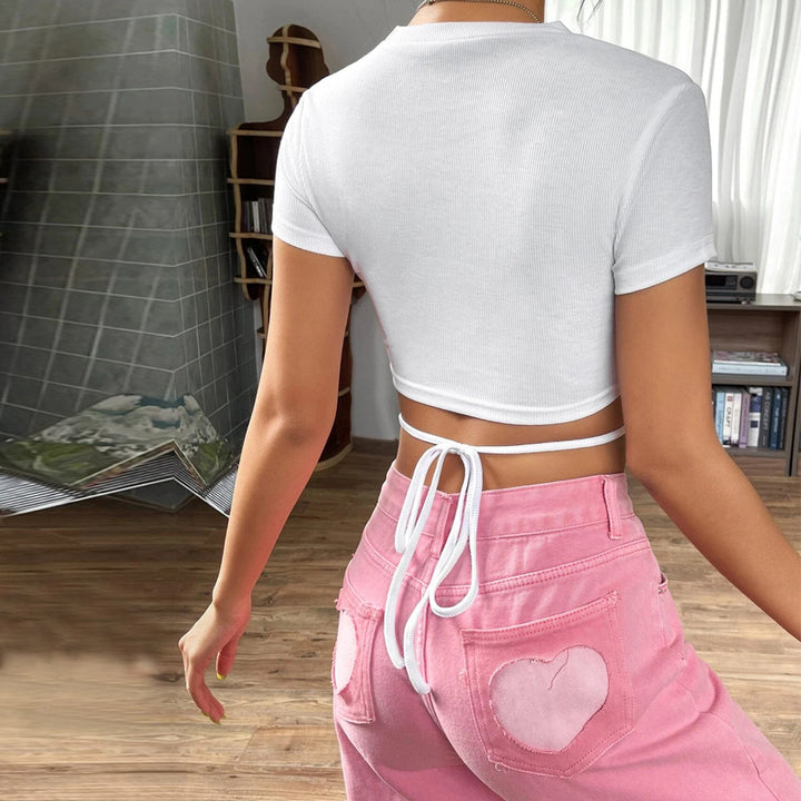 Short top for women with a playful wrap design and fine ribbed details Chic & Stil