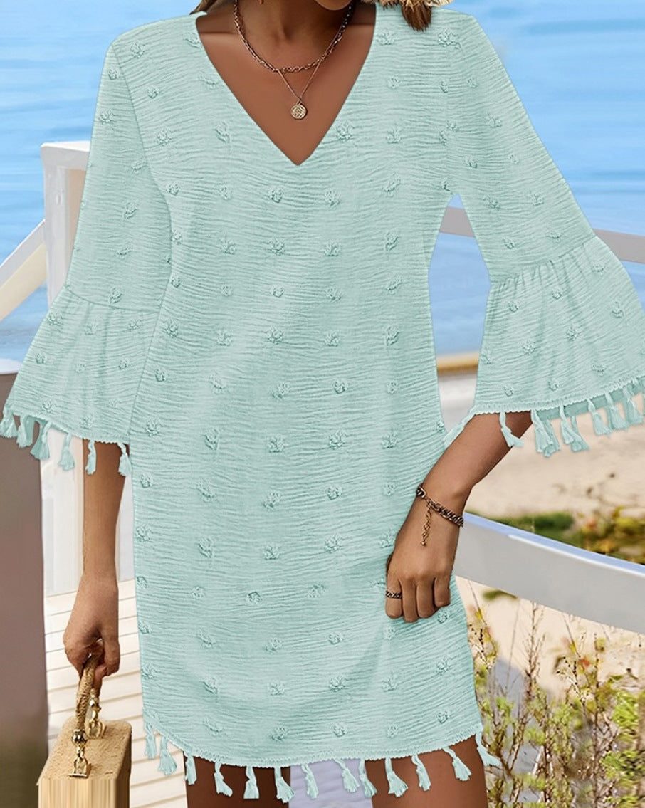 Beach dress for women with an elegant V-neckline and decorative fringes Lune London