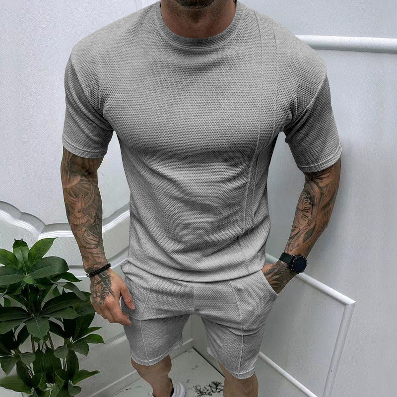 Men's short sleeve sports set with an innovative textured design and practical side pockets Lune London