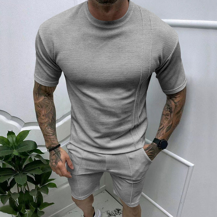 Men's short sleeve sports set with an innovative textured design and practical side pockets Lune London