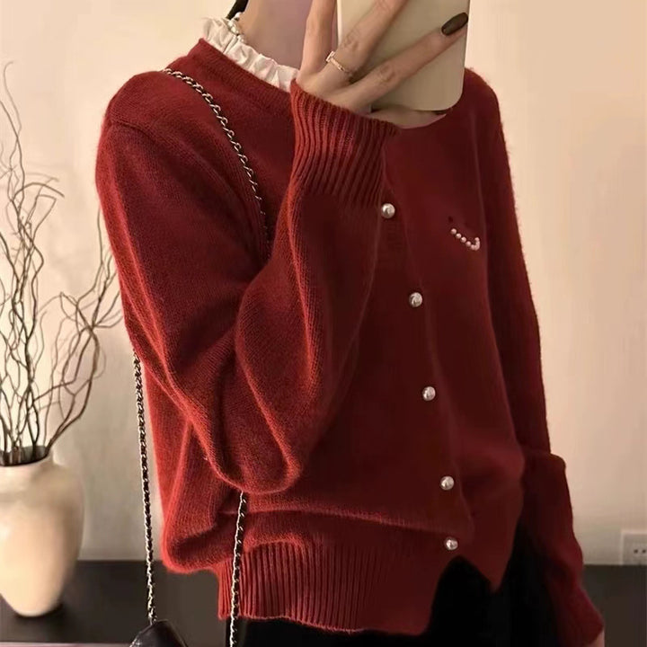 Women’s knitted jacket with decorative buttons and festive design Lune London