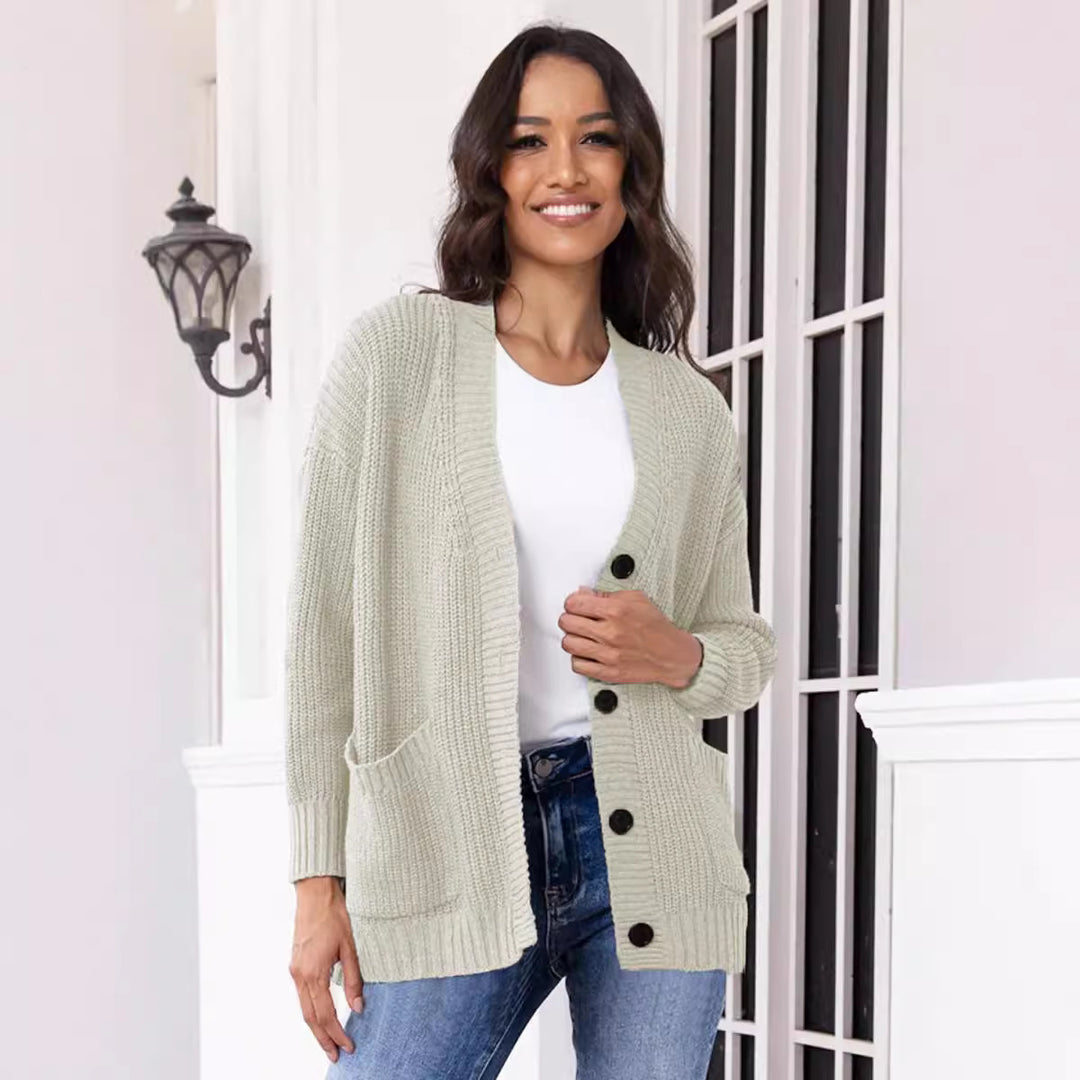 Fashionable knitted jacket for women with button closure all the way down and large pockets Lune London