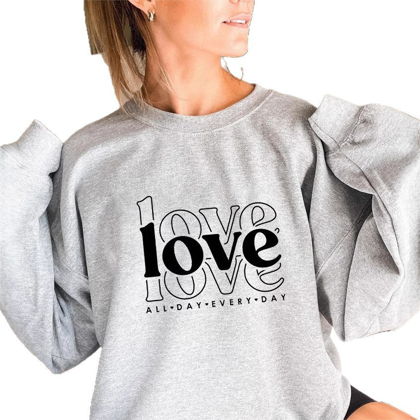 Sweat-shirt pour femmes avec des manches volumineuses et imprimé moderne "love" Chic & Stil