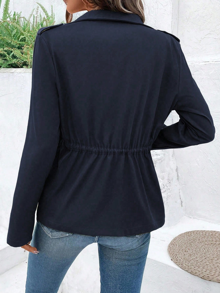 Women's transition jacket with practical pockets and adjustable drawstring.