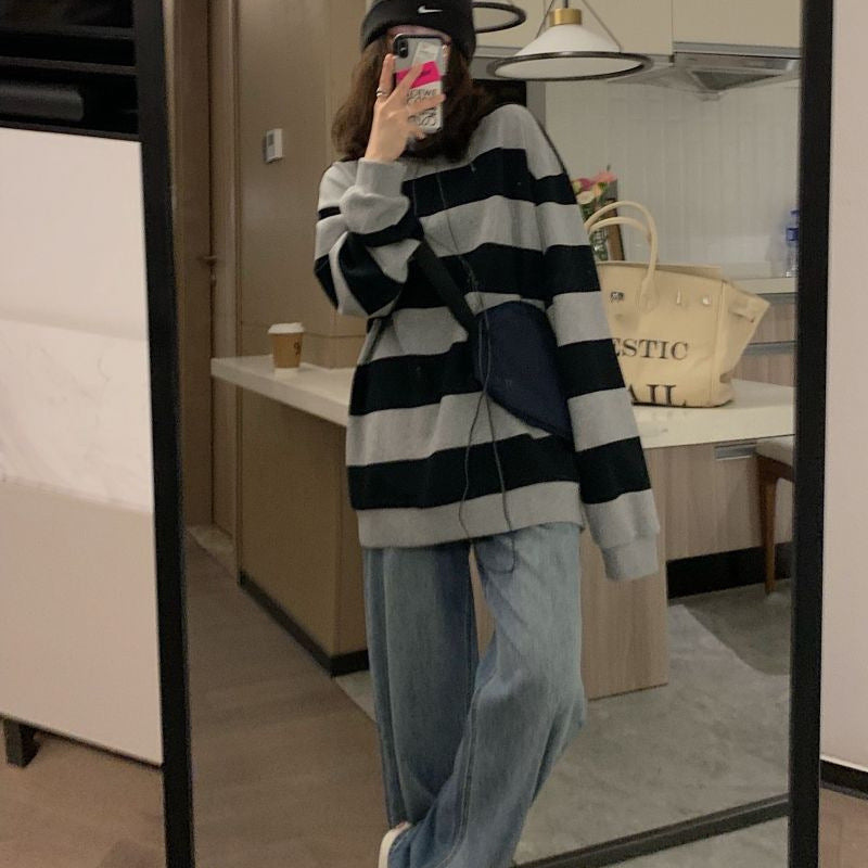 Women's casual knit sweater with wide stripes and cozy oversized fit