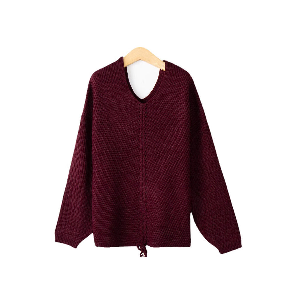 Women's thick knit sweater with an attractive V-neckline and practical drawstring details Lune London