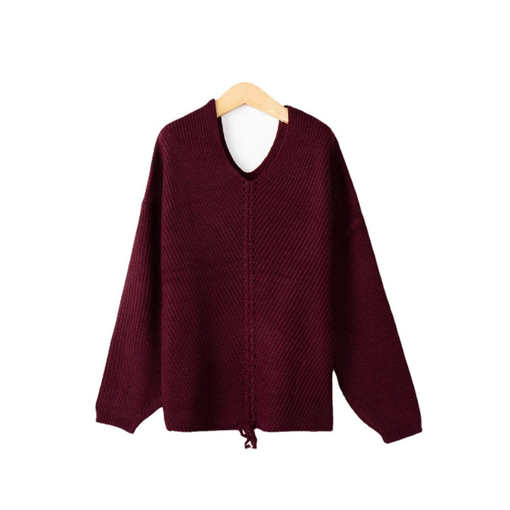 Women's thick knit sweater with an attractive V-neckline and practical drawstring details Lune London