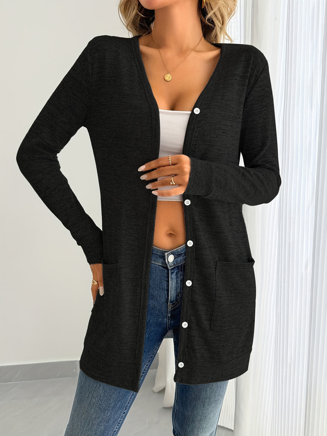 Ladies long sleeve cardigan with practical pockets and button placket Lune London