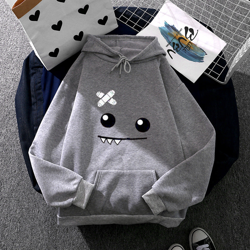 Women's hoodie with playful monster design Chic & Stil