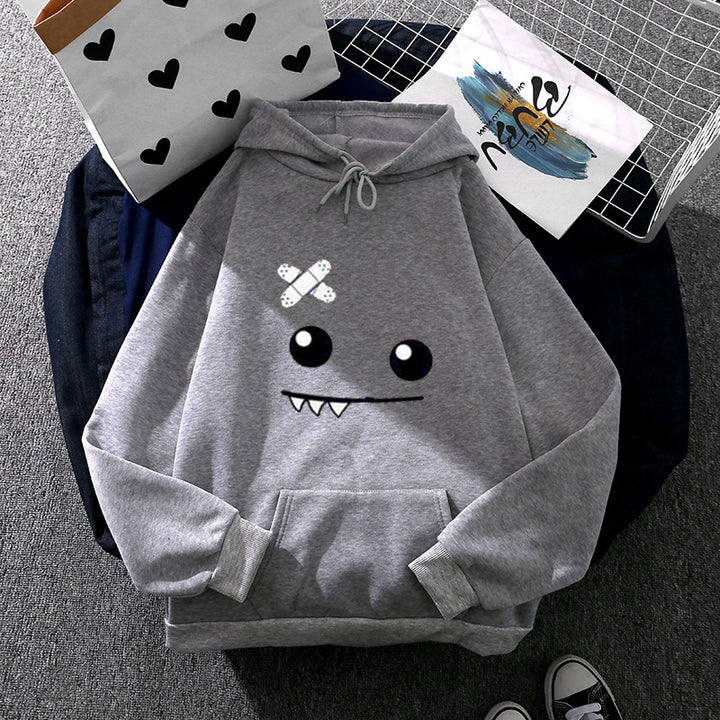 Women's hoodie with playful monster design Chic & Stil