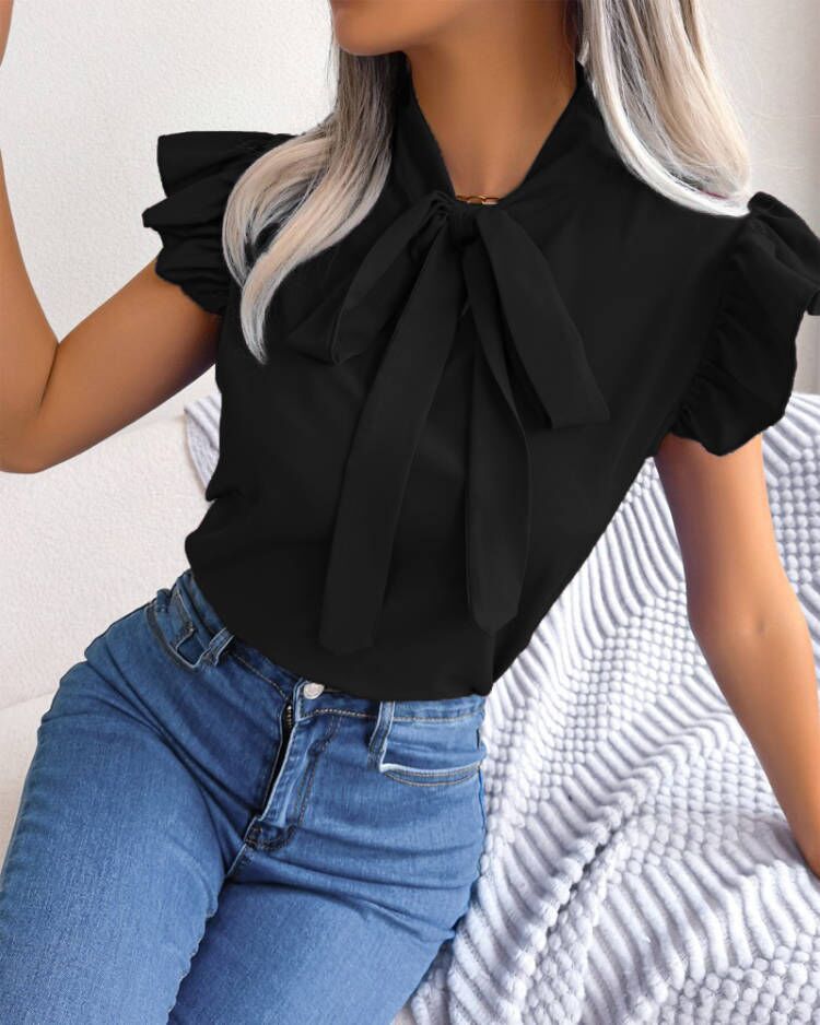 Elegant woman bow tie blouse Lune London