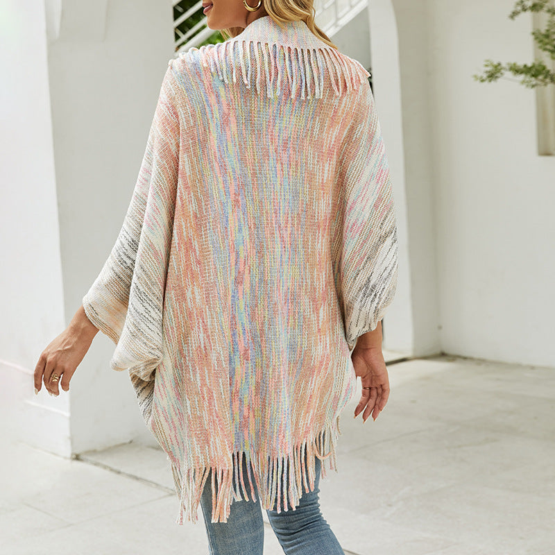 Trendy women's poncho with fringed hem and structured design Lune London