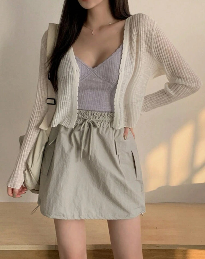 Femmes cardigan ludique avec des détails décoratifs et un matériau léger Lune London