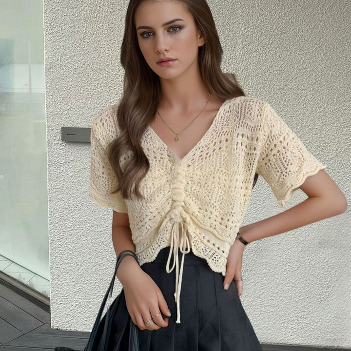 Women's knit top with decorative hole pattern and adjustable hem Lune London