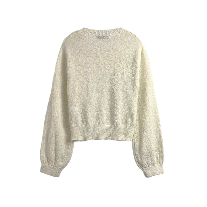 Knitted jacket for women with delicate crochet accents and a chic button placket