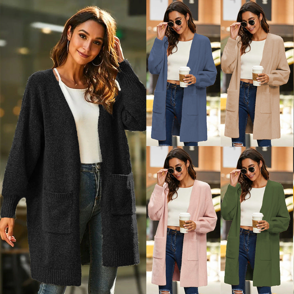Ladies chunky knit kimono cardigan with open sleeves and practical pockets Lune London