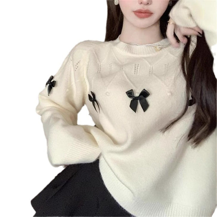 Pull confortable pour femmes avec des appliqués en nœud ludiques Chic & Stil