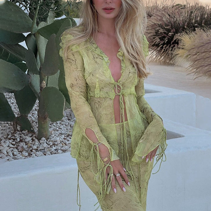 Elegant maxi dresses with cutouts for women featuring fluid fabric and refined ruffle details Lune London