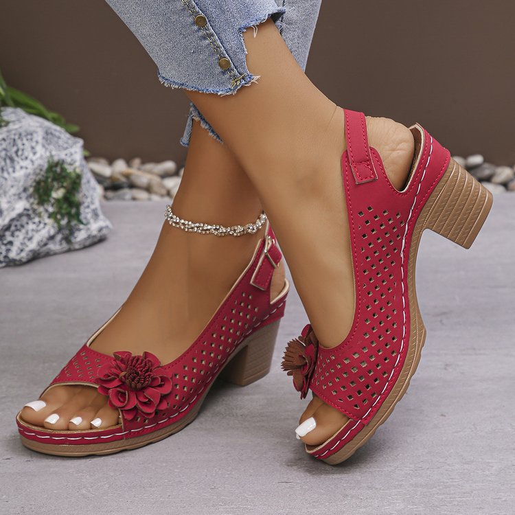 Women's clogs with a decorative floral detail and a perforated surface Lune London