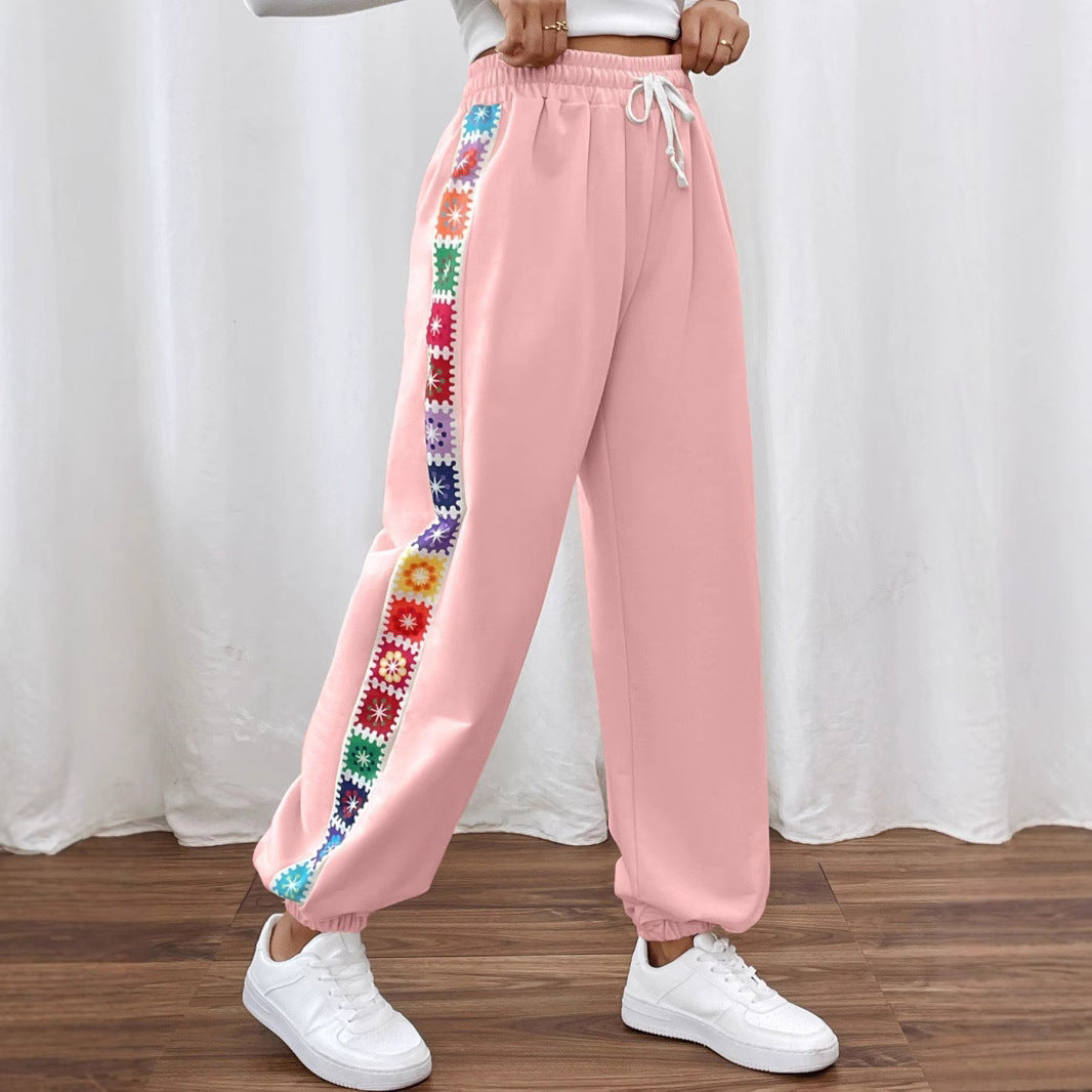 Leisure pants for women with a colorful floral pattern and an elastic waistband Lune London