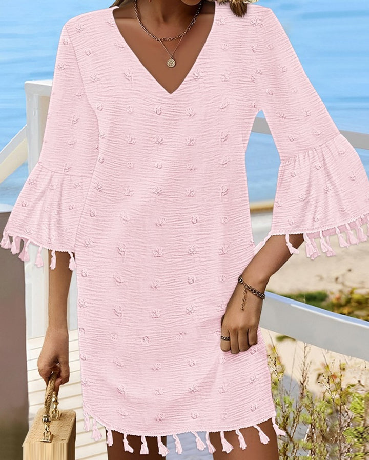 Beach dress for women with an elegant V-neckline and decorative fringes Lune London