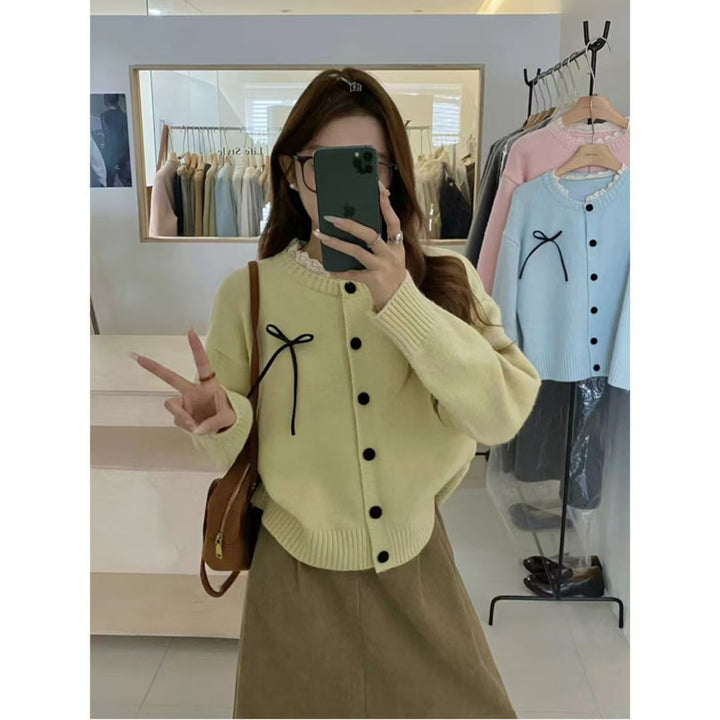 Knit cardigan for women with decorative buttons and a bow accent Lune London