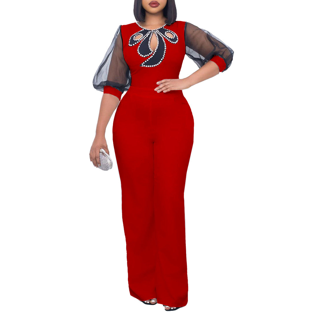 Elegant woman’s jumpsuit with sheer sleeves and pearl embellishment Lune London