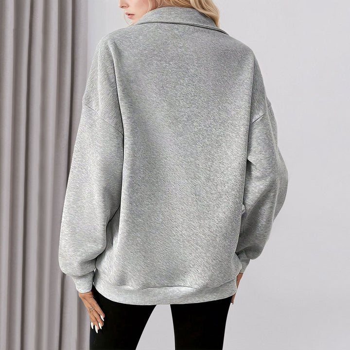 Sweat-shirt décontracté pour femmes avec une demi-fermeture éclair et poches pratiques Chic & Stil