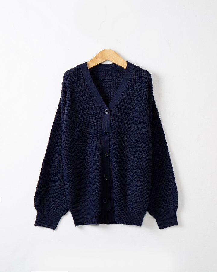 Women's knitted jacket with structured pattern and practical button details Lune London