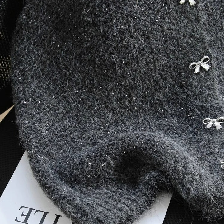 Gilet en tricot pour femmes avec accents scintillants et boutons décoratifs Chic & Stil