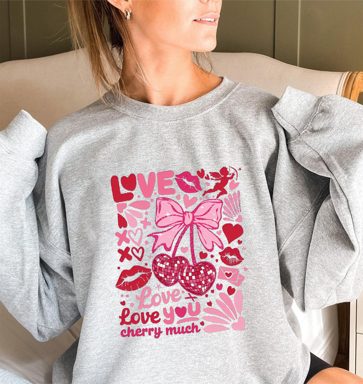 Sweat-shirt pour femmes avec des manches volumineuses et un motif cerise ludique Chic & Stil
