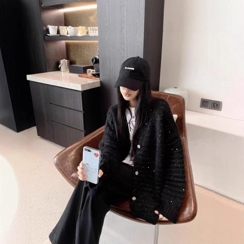 Knitted jacket for women with voluminous sleeves and a unique mesh structure Lune London