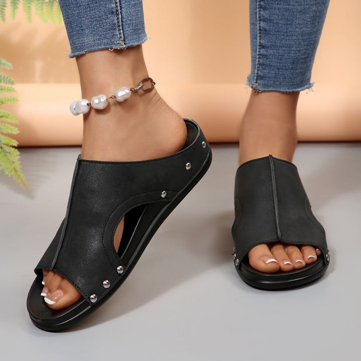 Comfortable slip-on sandals for ladies with a trendy cut-out design and an elegant rhinestone pattern Lune London
