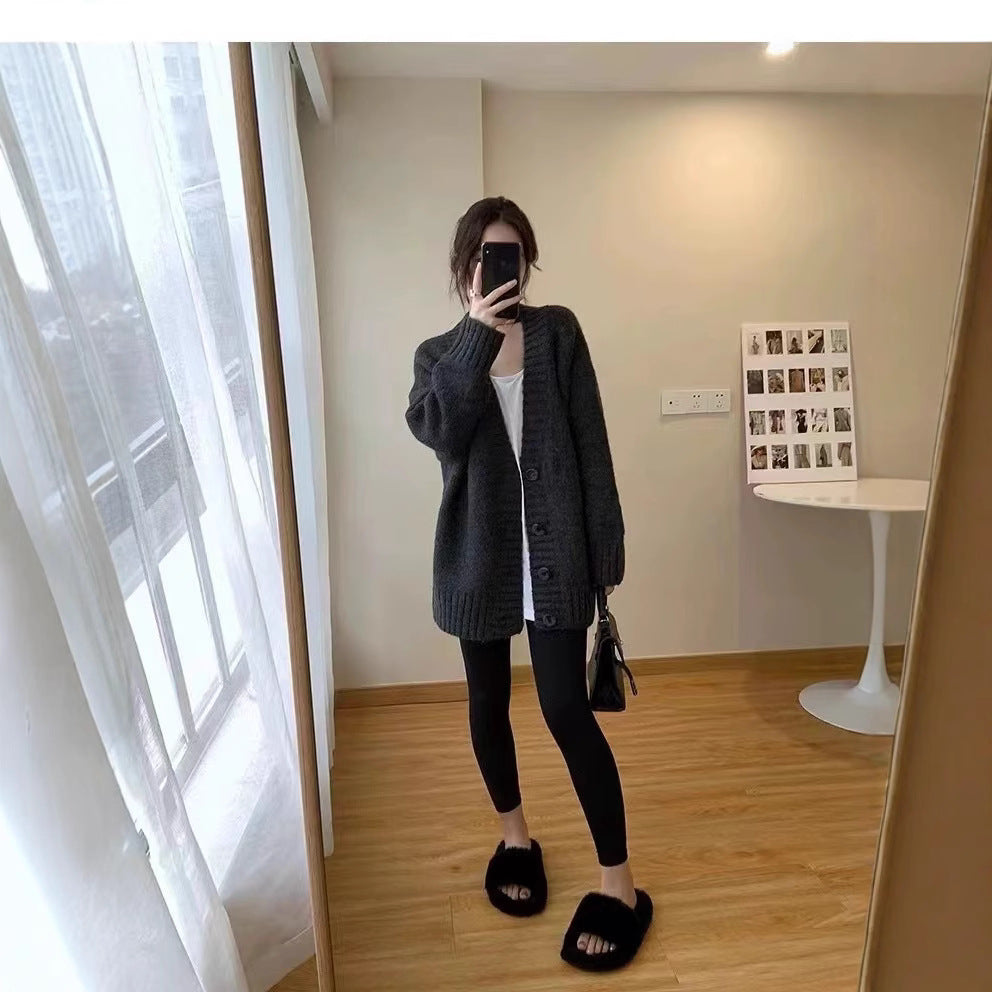 Oversized knitted jacket for women with a deep V-neck and button details Lune London