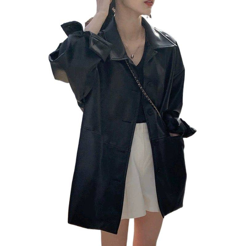 Women's fashionable leather jacket in oversized style with classic collar and decorative buttons Chic & Stil